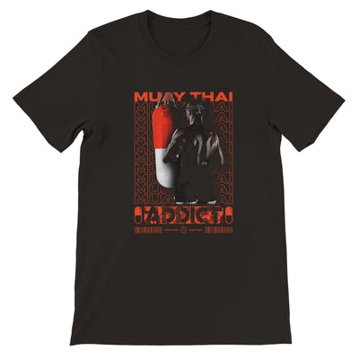 muay thai shirt with a design that says muay thai addict and it has a picture of a muay thai fighter facing a muay thai bag 