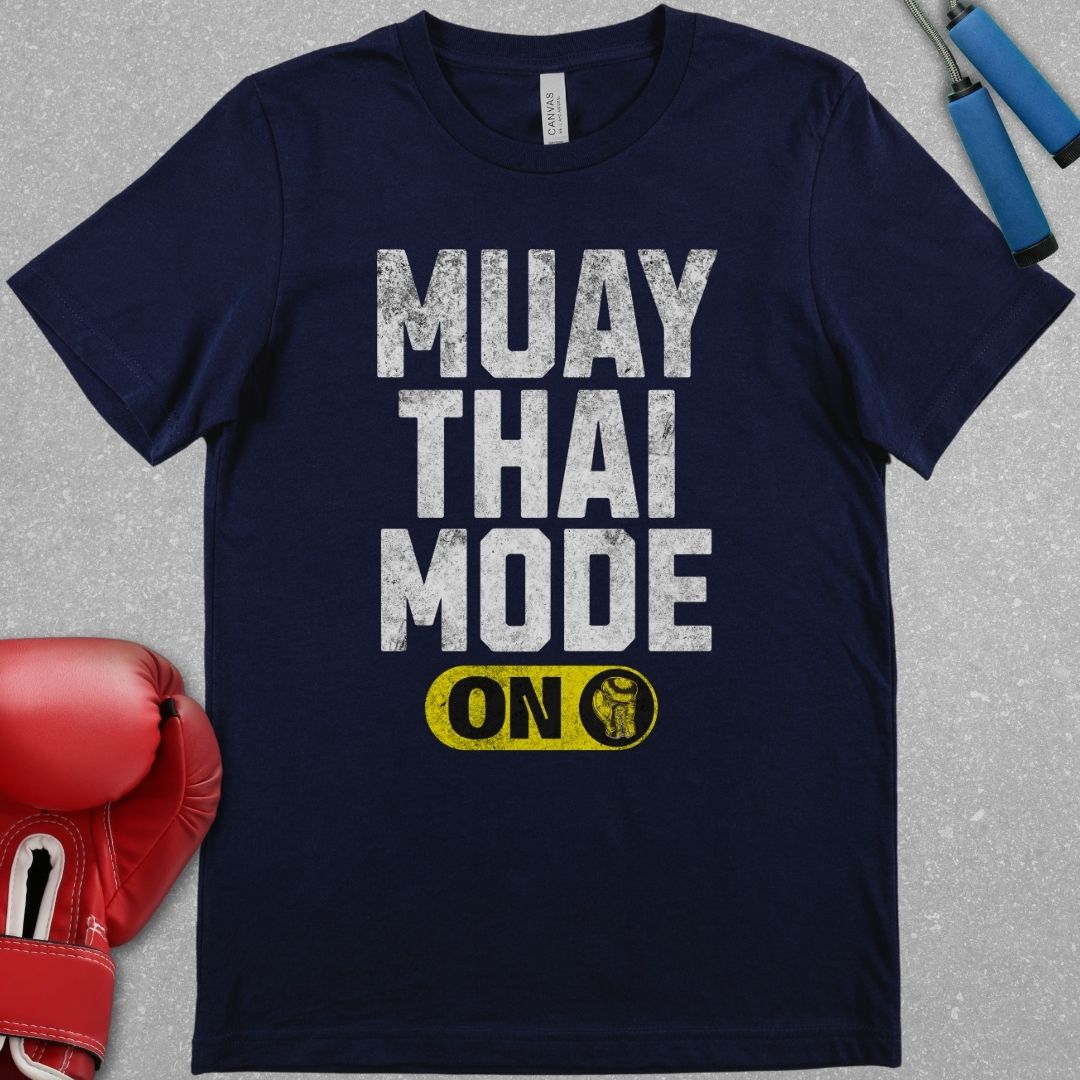 Navy shirt with a design that says Muay Thai Mode On.