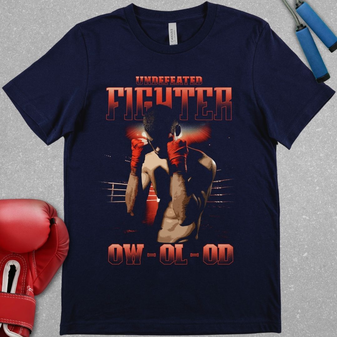 Navy shirt with a design that has the words undefeated fighter at the top of the design and 0W 0L 0D at the bottom of the designs. The design has a fighter with his hands up in the ring.