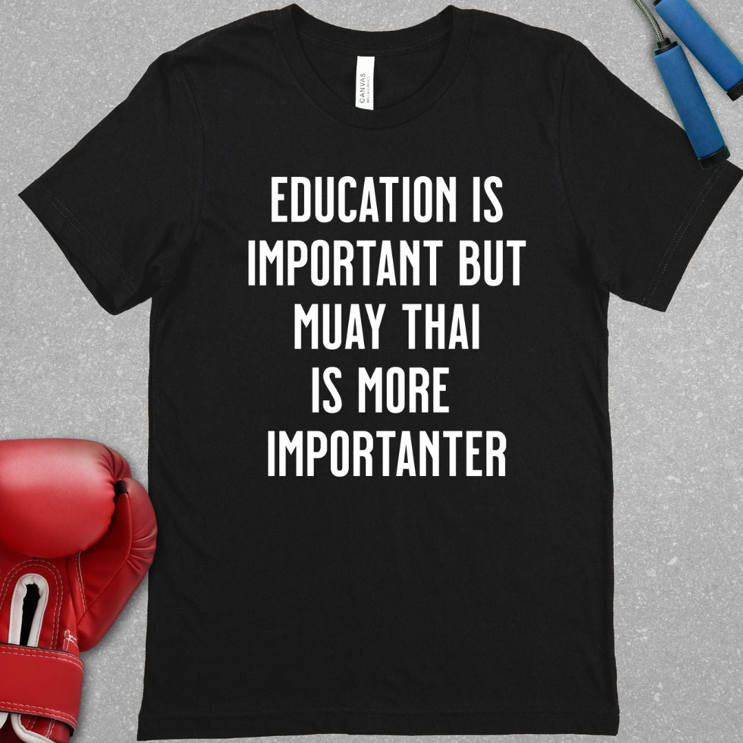 Black shirt with text that says Education is important but Muay Thai is more importanter