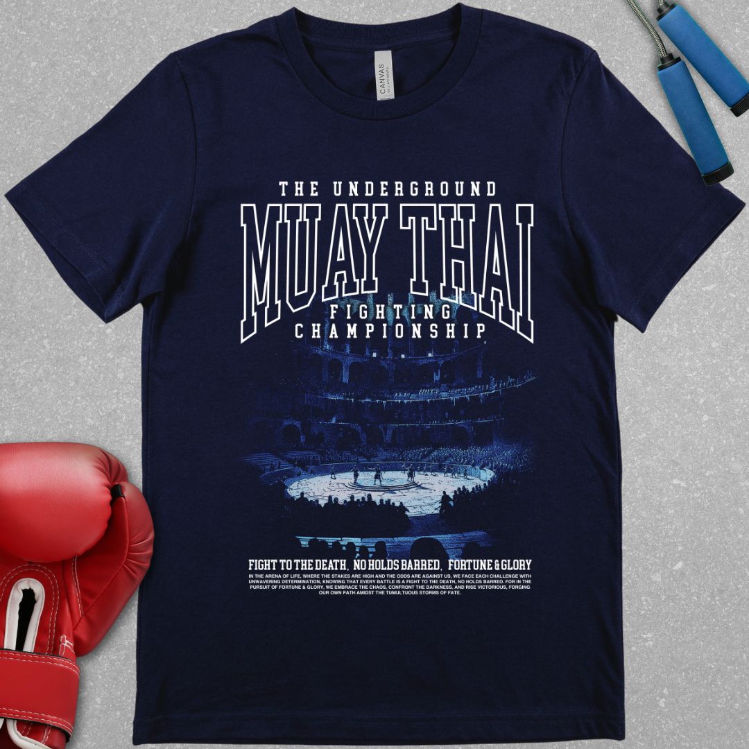 Navy shirt with a muay thai related design. The design has text at the top that says The Underground Muay Thai Fighting Championship and there is a picture of the colosseum.